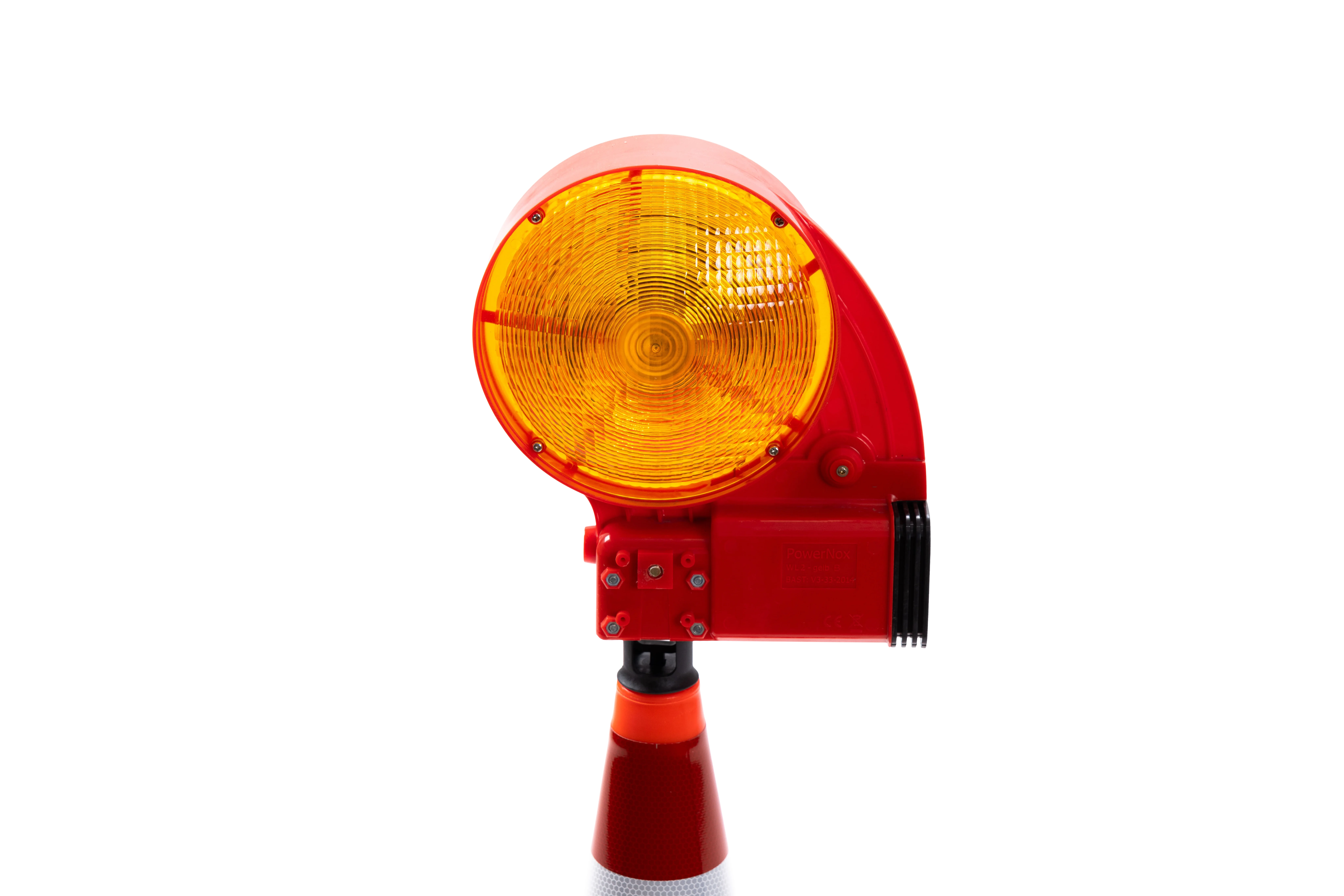 Detailansicht der NOX Blitzleuchte auf einem Leitkegel – gelbe Warnleuchte mit rotem Gehäuse zur Absicherung von Gefahrenstellen.